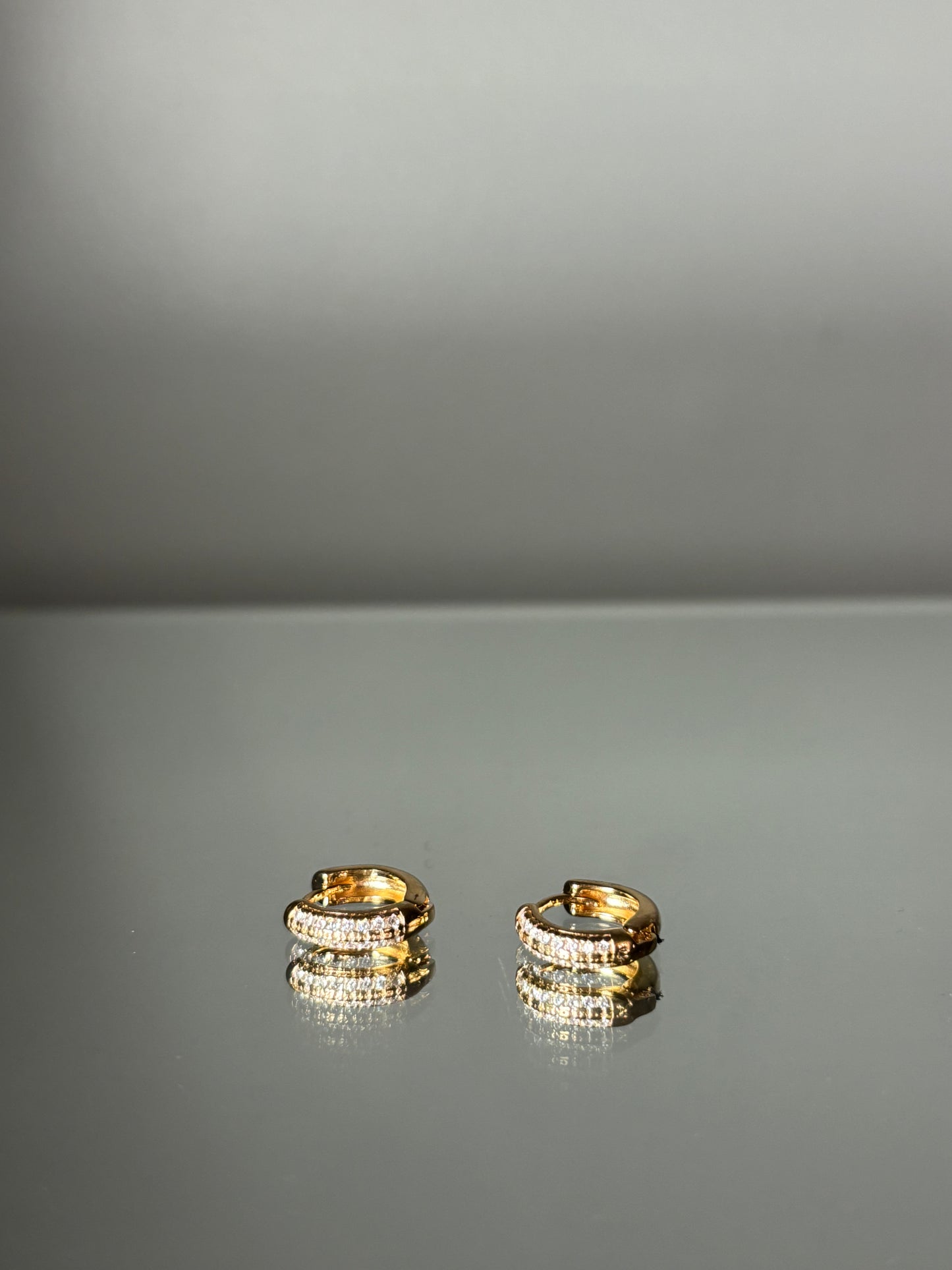 GOLD CZ HUGGIE EARRINGS